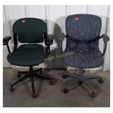 Two office desk chairs, both used with a little