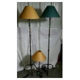 Three lamps with shades. Two floor lamps, one