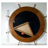 Flag case in the shape of a ships wheel. 24"
