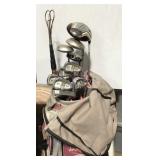 Lady Hagen golf bag with clubs, balls, gloves, and