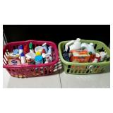 Two laundry baskets full of assorted cleaning