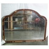 Mirror with arched design. Veneer is peeling.