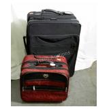 Two suitcases. Both are rollers. One large, one