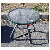 Round glass top patio table, 17 inches tall and