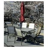Patio table with six chairs and umbrella seller
