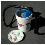 True Value bucket with the partial bag of Paw thaw