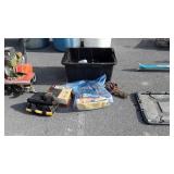 Black storage tote with misc roof rack parts,