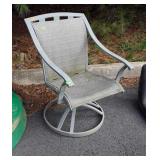 Swivel patio chair, does have tear in fabric