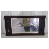 Early hall mirror with decorative cutouts, signs