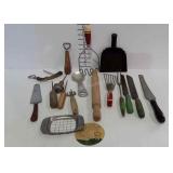 Kitchen utensils, some red &  green handles -meat
