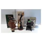 3 Figural whiskey decanters with boxes - pot belly