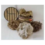 Hatbox with lid, 9 wigs & 1 hair piece