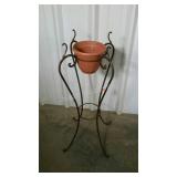 Four footed wrought iron plant stand with