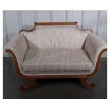 Antique Loveseat, parlor style having the decor