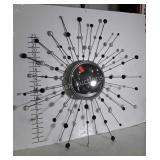 Designers wall mirror, moon burst design frame.
