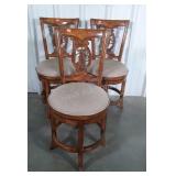 Three home counter stools with swivel padded seat