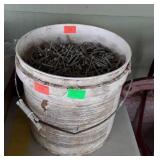 Small bucket full of nails