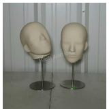 Two mannequin heads on stands code k