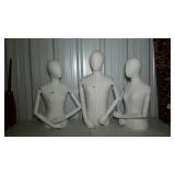 3 cloth covered mannequins with articulating