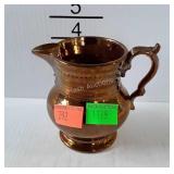 Copper luster cream pitcher