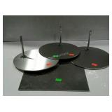 3 round mannequin stands and one square without