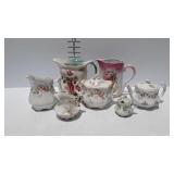 Painted china pitchers, teapot, creamer, etc -