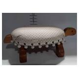 Footstool, turtle shaped with padded upholstered
