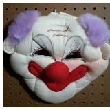 Plush clown mask.