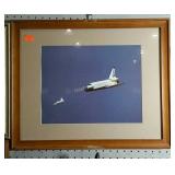 Framed and matted picture of space shuttle being