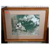Framed and matted space shuttle picture while in
