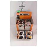 16 Matchbox vehicles with counter top display box