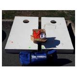 White corn hole boards with bags, and top toss