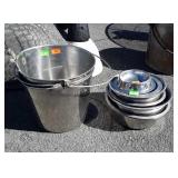 Two stainless steel buckets and dog water bowls