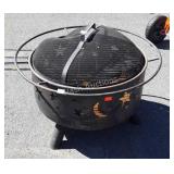 Fire pit with moon and star design on sides