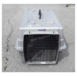 Small plastic pet carrier