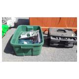 Green tote with extension cords and small plastic