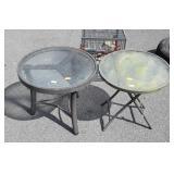 Two small round patio tables, one does fold