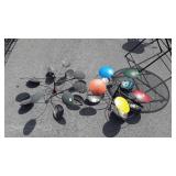 Two lawn decor Whirly gigs