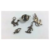 Five Sterling silver charms