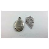 Two Silver Plated Charms One Of The State Of