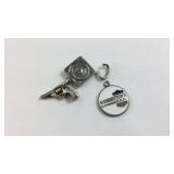 Sterling Silver Gun And Target Charm And A Silver