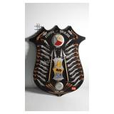 Shield with examples of the Weapons of Moroland,