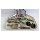 Kitchen utensils, some green handled - can openers