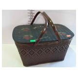 Older wicker picnic basket with metal handles,