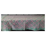 Pink and green lightweight quilt, shows some