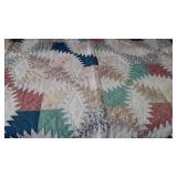 Bright and colorful quilt, white background,