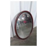 Mahogany oval framed beveled glass mirror,