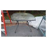 Glass top patio table is 44 by 44 by 30