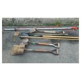 Group of shovels and a limb saw