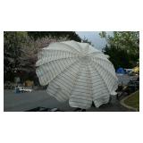 Patio umbrella,  missing half of pole